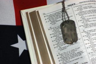 dog tags over a Bible